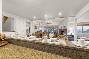 The breakfast bar and open concept living and dining area.