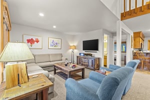 Snowflower 41 offers a spacious living area with two club chairs and sectional sofa.