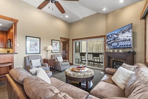 Snow Flower 123 offers a spacious living room with flat screen TV and gas burning fireplace.