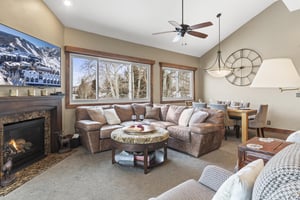 Snow Flower 123 offers a large sectional sofa to relax on next to the fire.