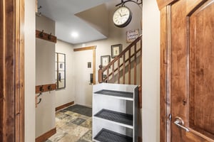 The entryway has storage for gear and plenty of hooks to hang coats.