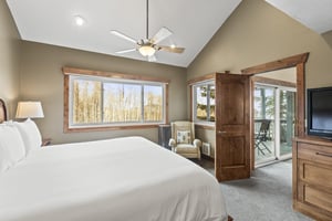 The main suite has a kingsize bed and large picture windows with views of the aspen grove.