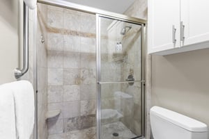 The en suite bathroom has a walkin shower.
