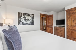 The second bedroom offers a kingsize bed and flat screen TV.