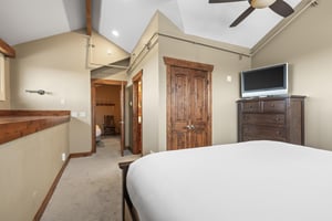 The third bedroom offers a king size bed and TV.