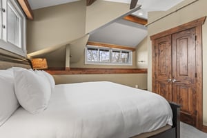 The third bedroom offers a king size bed and well appointed furniture.