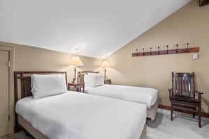 The loft offers two twin beds and coat racks.