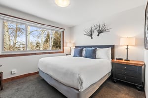 The second bedroom offers a kingsize bed and large picture window.