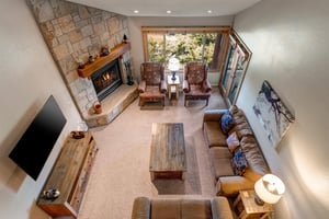 The living room has a comfortable couch, loveseat and two club chairs.