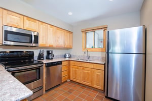 Snow Flower 28 has a wellequipped kitchen with stainless steel appliances.