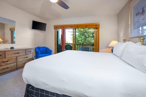 The main suite has a king size bed and private patio access.