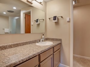 The en suite bathroom with another sink area.