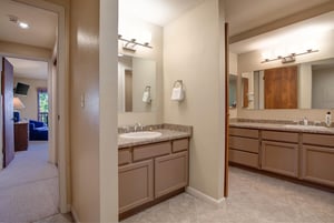 The en suite bathroom and one of two sinks.