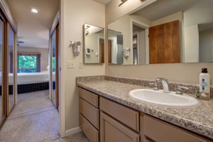 The en suite bathroom with another sink area.