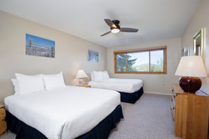 A bedroom with two queen beds.