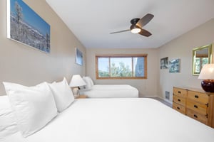 A bedroom with two queen beds.