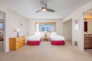 The loft has two twin beds and wood furniture.