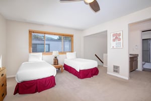 The loft has two twin beds and wood furniture