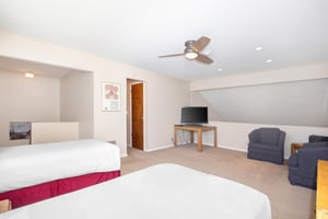 The loft has two twin beds, TV, and a sitting area.