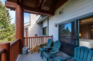 The private deck has four chairs and a small table.