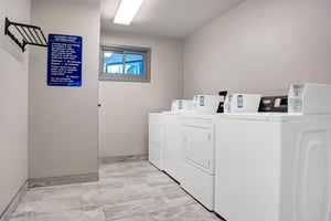 Common laundry room located on the second  third floors. Machines accept both coin payment and credit card via smartphone app