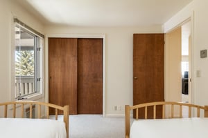 Guest bedroom with two twin beds.