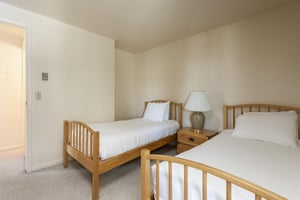 The guest bedroom with two twin beds.