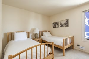 The two twin beds in the guest bedroom