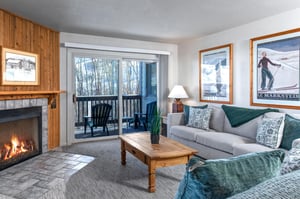 The living room offers a comfortable couch and loveseat in the living room.