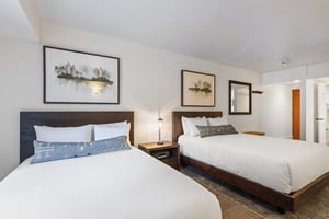 This is a beautiful hotel style room that offers two queen size beds and wellappointed furniture.