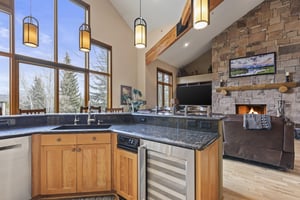 Cove Retreat has a large kitchen island with built in wine fridge.
