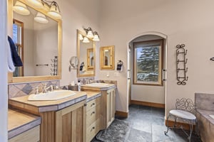 The en suite bathroom with two sink vanity.