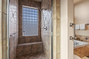 The en suite bathroom with walk in shower.