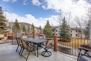 The outside patio on the second level offers a table with seating for 6 guests.