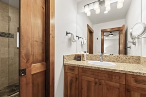 The main suite has an en suite bathroom with one sink granite vanity and separate water closet.
