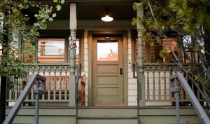 The front of Town Lift Chalet has awards on the front porch signifying an award winning Historic Home.