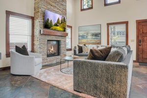 The Peak at Town Lift offers a living room with luxurious furnishing and stylish art.