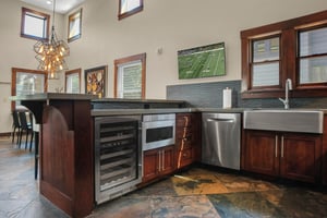 The vacation rental kitchen with wine fridge.