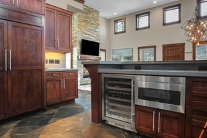 Vacation rental kitchen with undermount microwave.