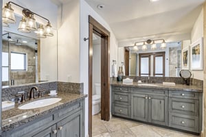Main bedroom bathroom with separate vanities
