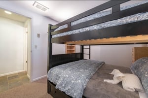 Second Bedroom with a twin over full bunk bed and twin trundle bed.