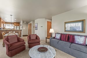 The living room offers comfortable furniture and an open concept.