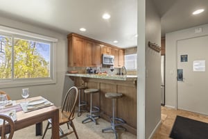 The breakfast bar offers seating for 3 guests.