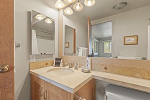 The shared bathroom has a single sink vanity.