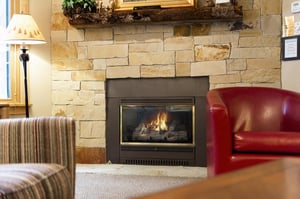 The living room has a cozy gas fireplace.