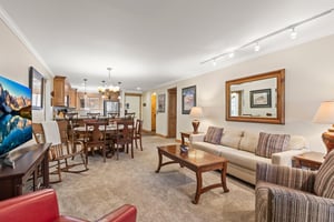 The living area with a comfortable couch and club chairs.