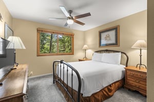The third bedroom has a queen size bed.