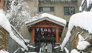 The Snow Flower Condominiums entrance with a variety of country flags.