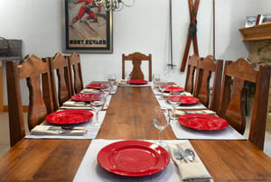 The wood dining table offers seating for 8.