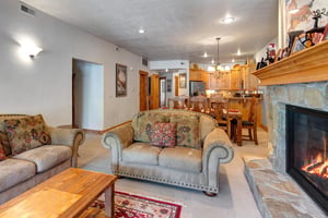 Town Pointe C302 has a cozy living room with love seat and couch.
